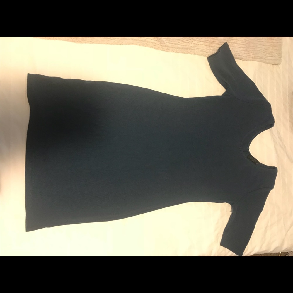 Stretchy, form fitting, darker blue dress.